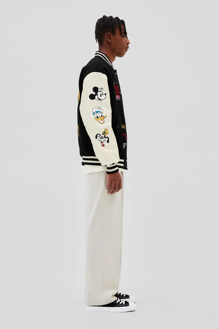Baseball-Disney-100-Yrs-Black-And-White-Jacket.webp