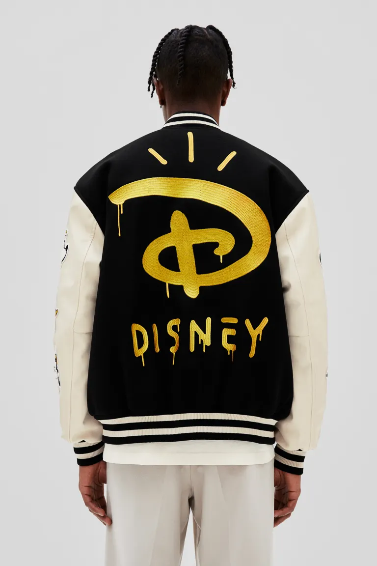 Baseball-Disney-100-Yrs-Black-And-White-Letterman-Jacket.webp