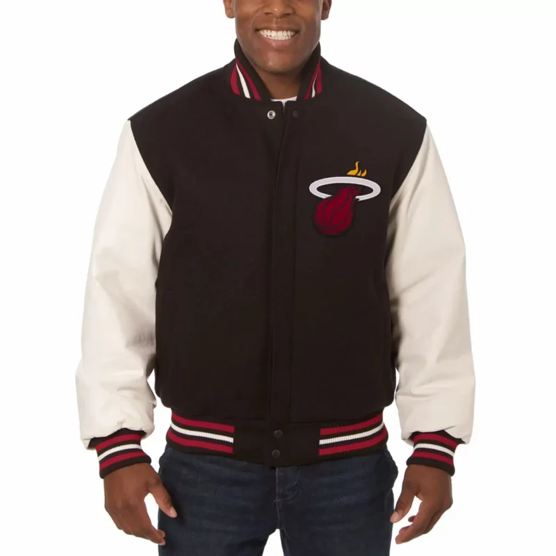 Black White Miami Heat Jeff Hamilton Varsity Jacket The Black White Miami Heat Jeff Hamilton Varsity Jacket is a bold tribute to basketball style and fan pride. Designed with a perfect mix of sporty edge and premium craftsmanship, this jacket celebrates the Miami Heat legacy with an iconic black and white color scheme. If you’re a Heat fan who loves fashion as much as the game, this varsity jacket is your ultimate statement piece. Made with high-quality wool and premium leather sleeves, the jacket ensures warmth, durability, and long-lasting wear. The Miami Heat team logos and championship-inspired patches give it an authentic touch, while the Jeff Hamilton design influence guarantees a standout look. With rib-knit trims, button closure, and soft lining, this varsity jacket offers comfort and confidence whether you’re at the arena, on the streets, or out with friends. Why Choose Us Officially inspired Miami Heat varsity jacket Premium Jeff Hamilton design details for collectors and fans High-quality construction for lasting wear Perfect mix of sports spirit and street fashion Exclusive 50% OFF deal with free shipping in 2025 Key Features Wool Blend Body: Durable and warm for all seasons Leather Sleeves: Premium black-and-white contrast for standout style Team-Inspired Patches: Miami Heat logos and detailed embroidery Jeff Hamilton Design: Iconic styling for collectors and die-hard fans Snap-Button Closure: Easy to wear with a classic varsity look Rib-Knit Trim: Secure fit at cuffs, collar, and hem Soft Inner Lining: Comfort for all-day wear Functional Pockets: Handy storage for essentials Bold Black & White Color: Striking contrast that matches any outfit Unisex Fit: Designed for Heat fans who want both comfort and style Conclusion The Black White Miami Heat Jeff Hamilton Varsity Jacket is more than sportswear—it’s a piece of Heat history. With its premium build, authentic team patches, and Jeff Hamilton’s legendary design influence, this jacket is perfect for showcasing your Miami Heat pride in style. Whether you’re watching the game courtside, hanging out with friends, or collecting iconic sportswear, this varsity jacket belongs in your wardrobe. Order yours now to grab 50% OFF with free shipping in 2025 and represent Miami Heat the right way.