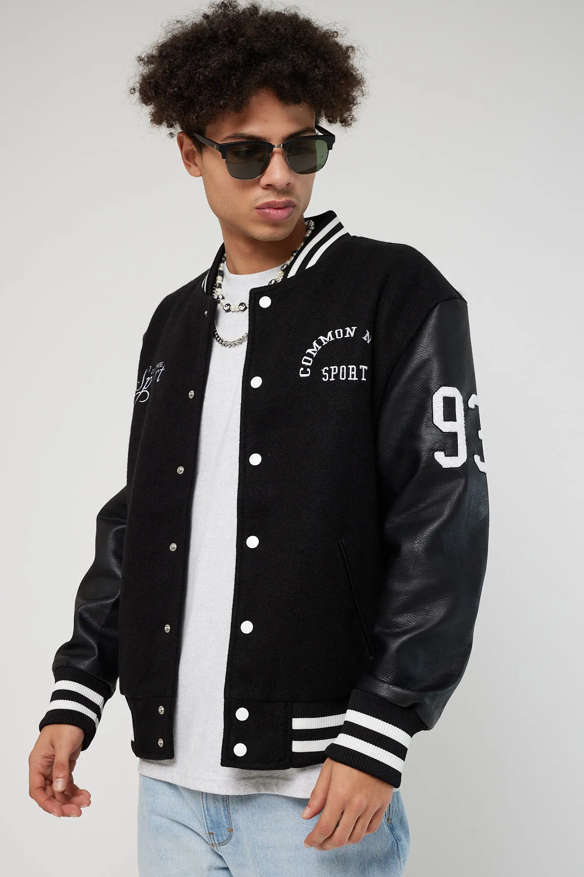 Common-Need-Sport-Black-Wool-And-Leather-Varsity-Jacket.webp